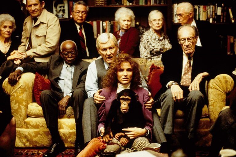 Lester and his friends sit around Lotte and Elijah in Being John Malkovich