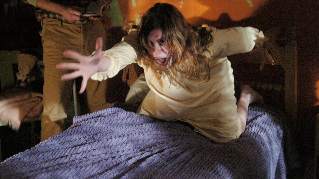 Emily Rose (Jennifer Carpenter) reacts badly to an exorcism being performed in The Exorcism of Emily Rose (2005)