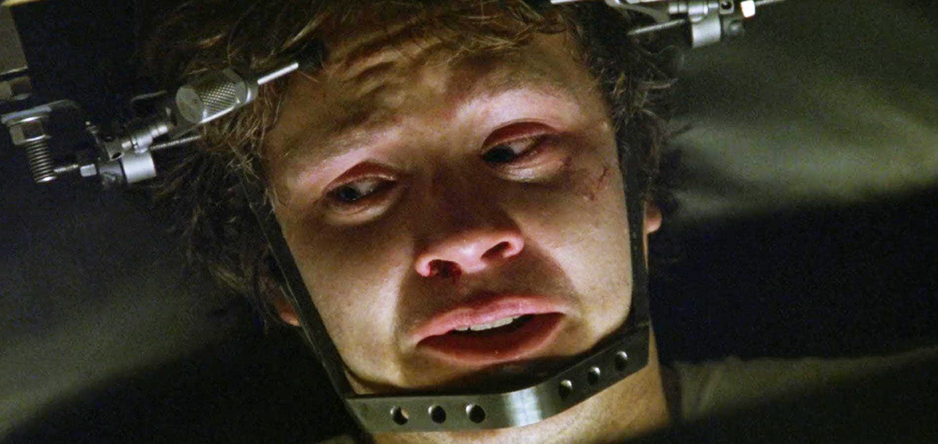 Jacob Singer (Tim Robbins) has a metal contraption attached to his head in Jacob's Ladder