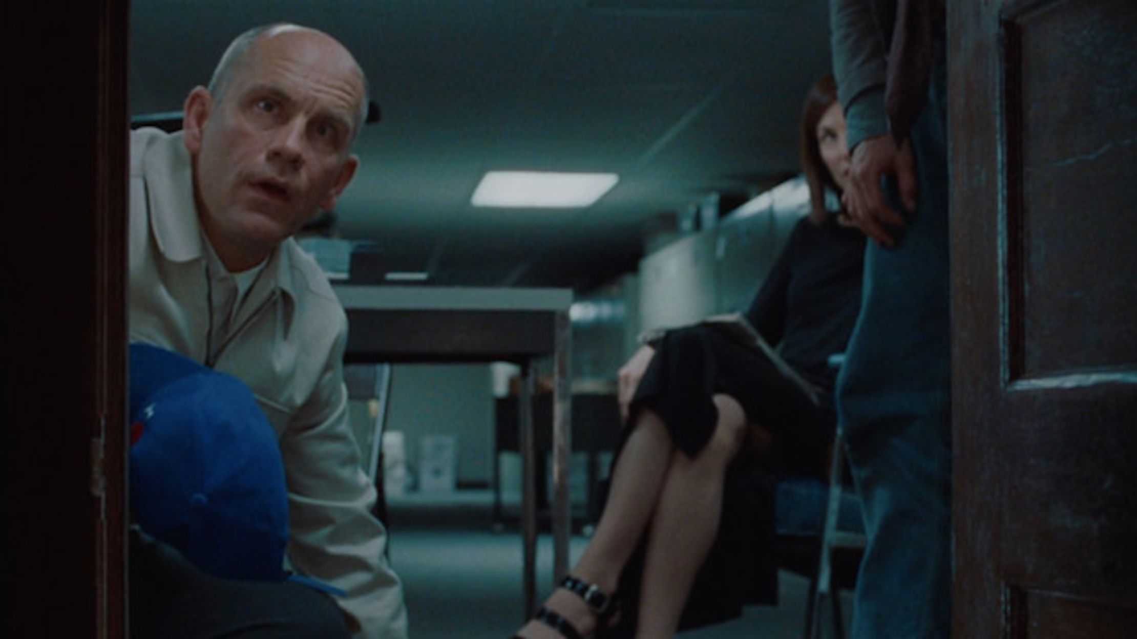 John Malkovich looks down a portal that going into his own mind in Being John Malkovich