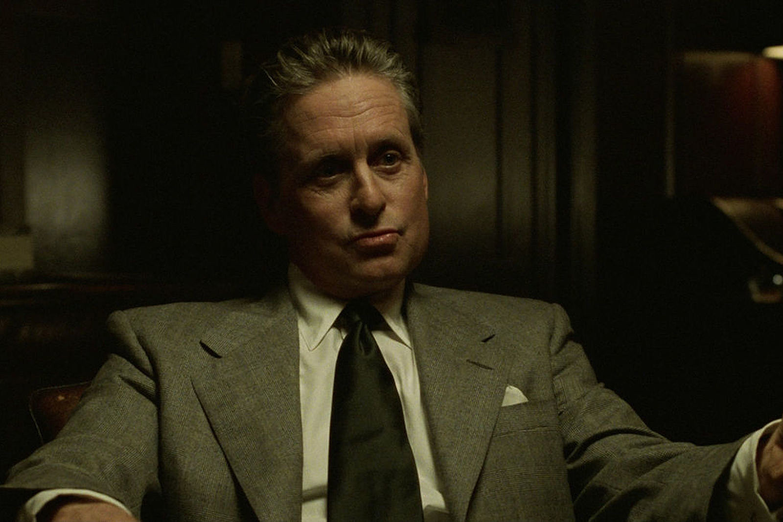Nicholas Van Orton (Michael Douglas) sits in a chair and stares in The Game