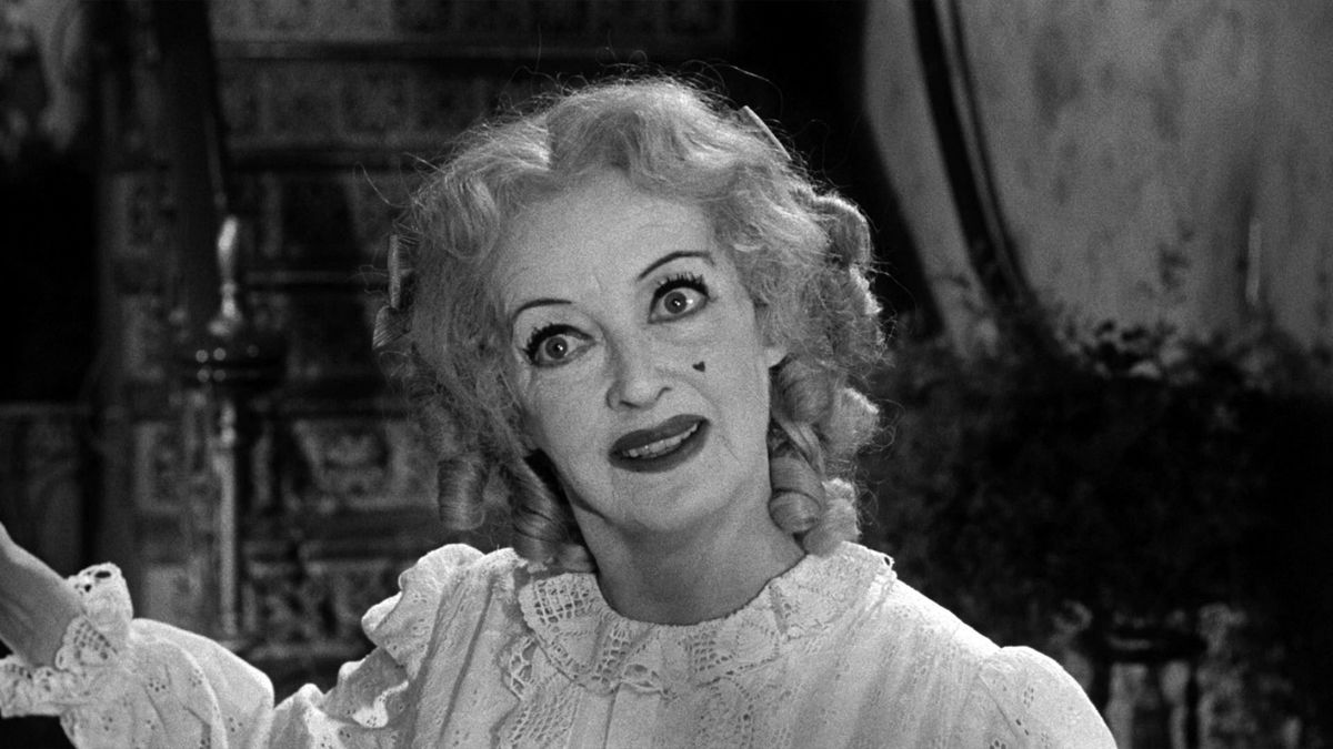Baby Jane Hudson wears makeup and has an crazed look on her face in What Ever Happened to Baby Jane