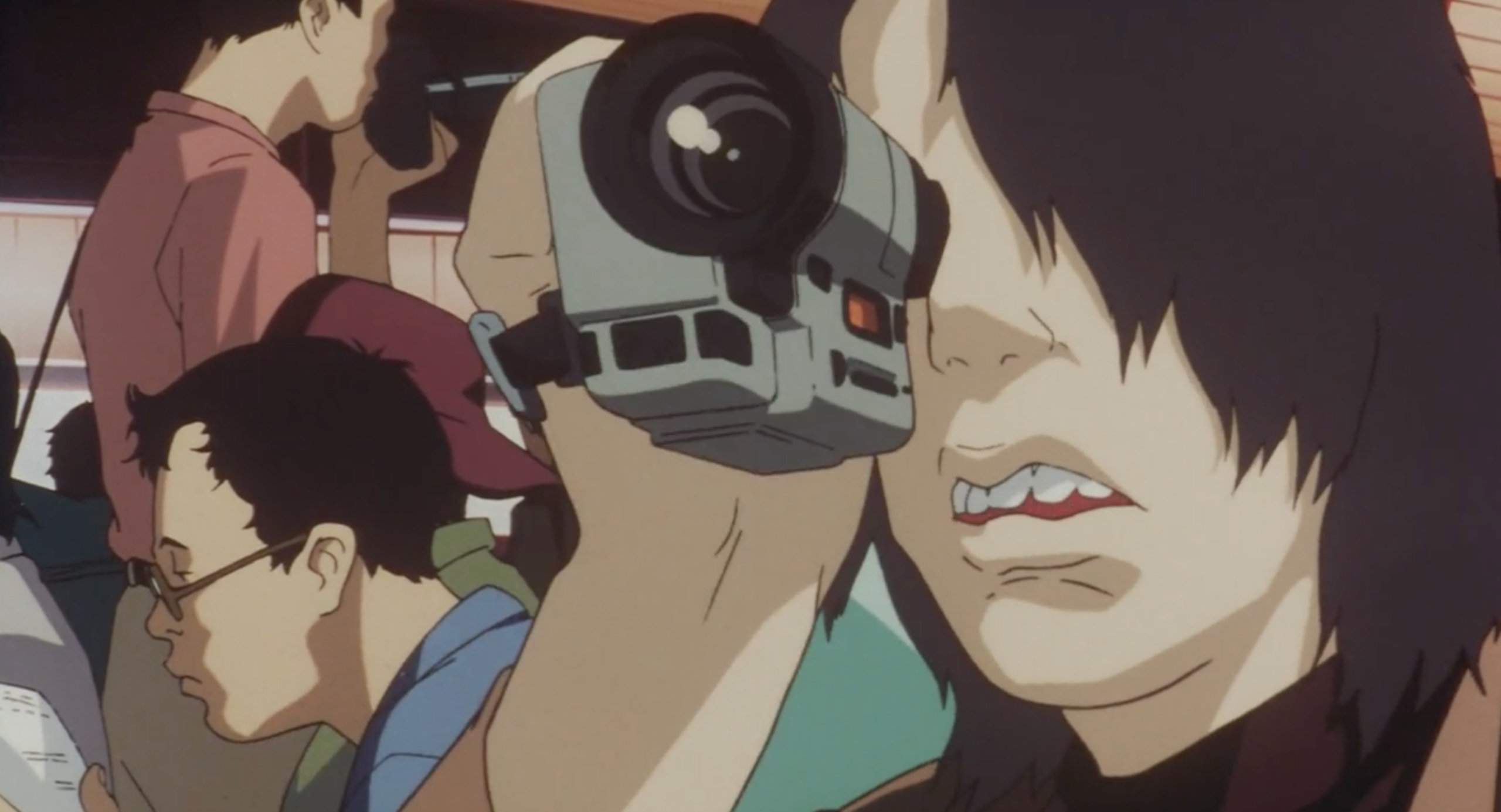 Me-Mania videotapes a poster of CHAM! in Perfect Blue