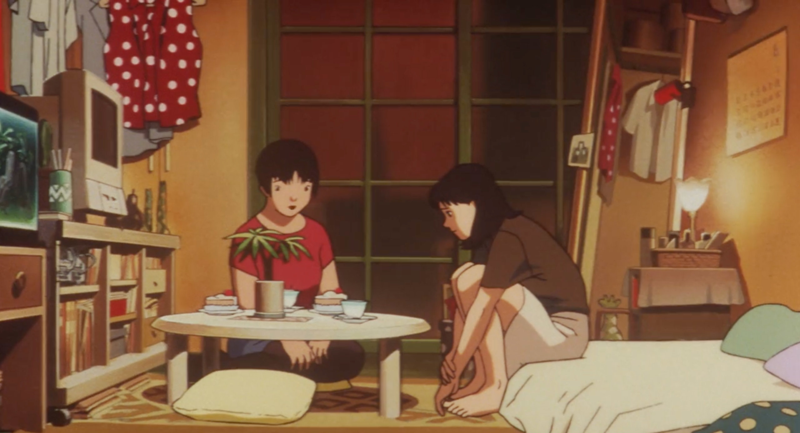 Rumi comforts Mima over cake and tea in Perfect Blue