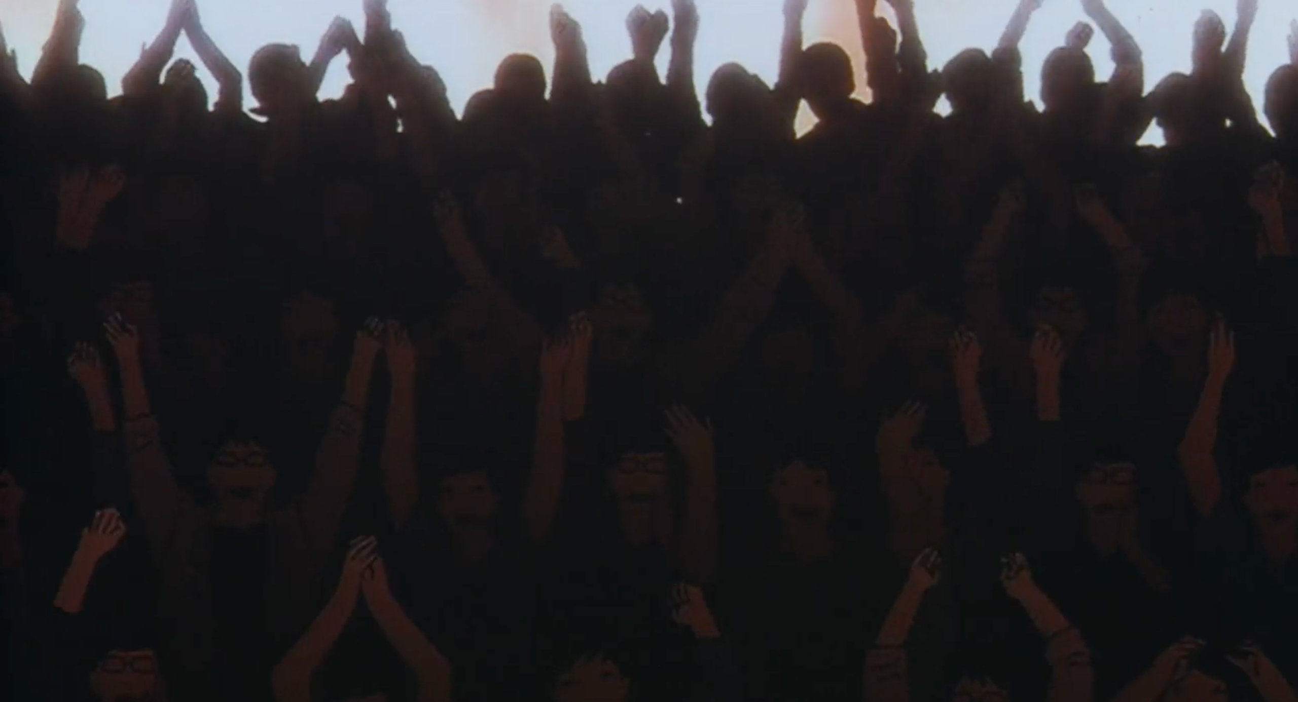 A crowd cheers for Mima after a rape scene for Double Bind in Perfect Blue