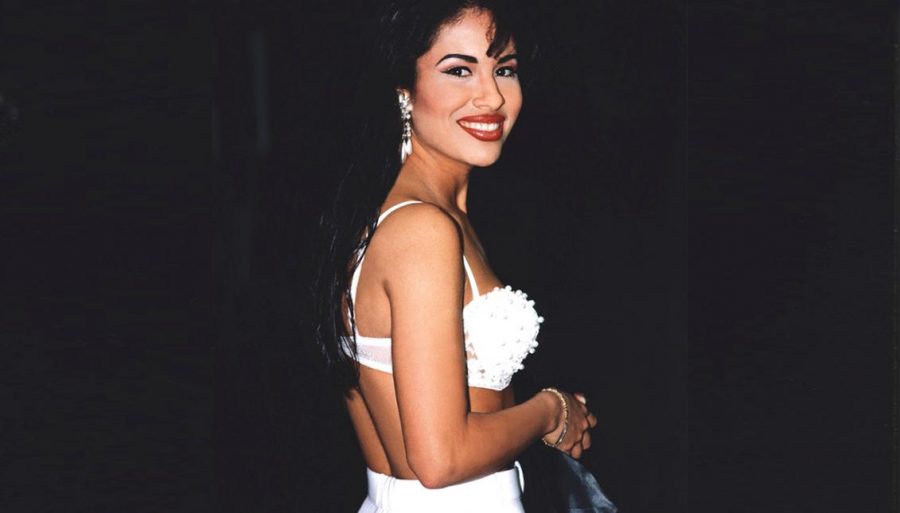 Selena Quintanilla-Pérez poses in a white outfit