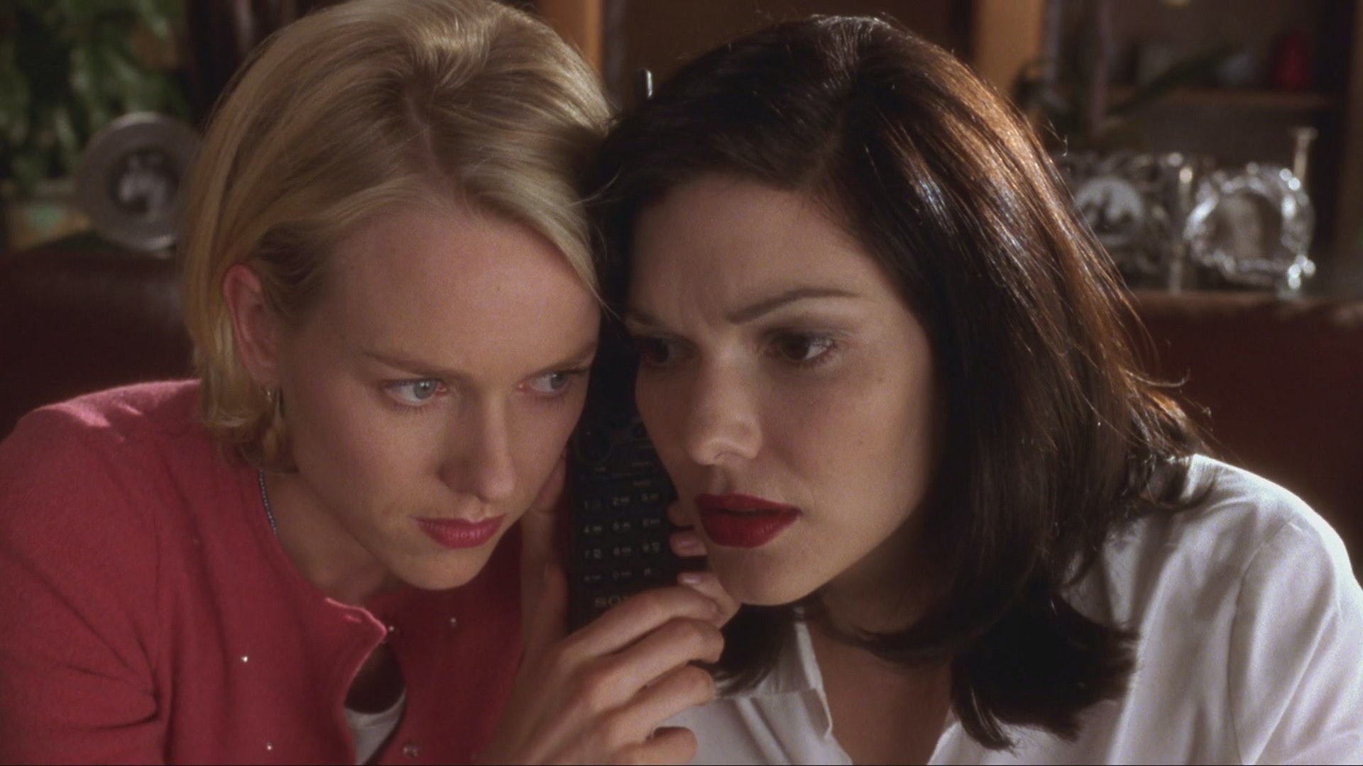 Diane (Naomi Watts) and Rita (Laura Harring) listen in on a telephone call in Mulholland Drive