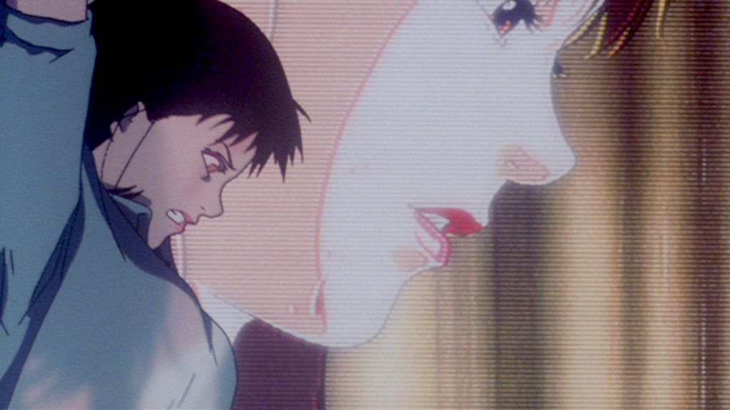 Mima goes to stab a man while her television show plays in the background in Perfect Blue