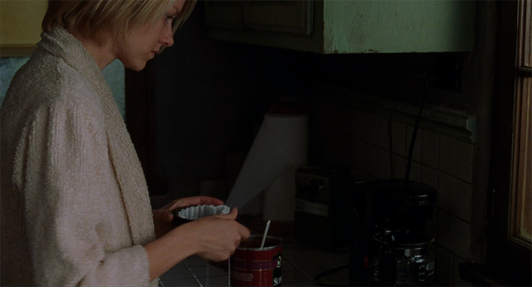 Diane makes coffee in her apartment in Mulholland Drive