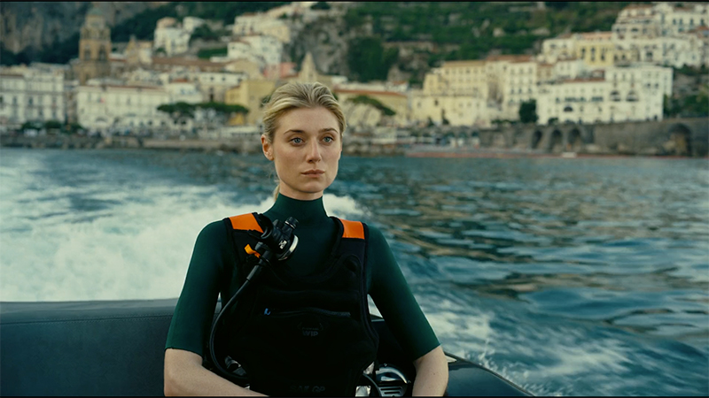 Kat (Elizabeth Debicki) sits in the back of a boat in Tenet