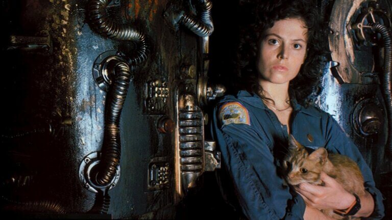 Ripley stands with her cat aboard a spaceship