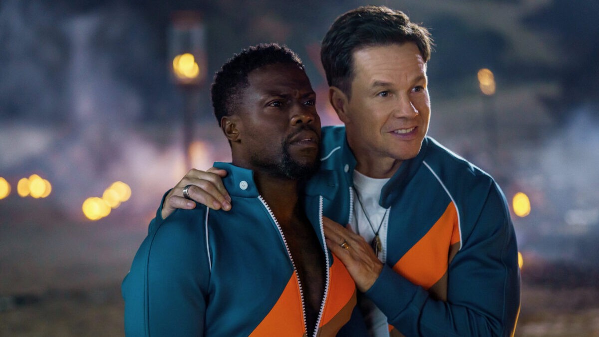 Mark Wahlberg places his hand on Kevin Hart's chest