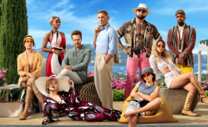 The cast of Glass Onion pose in character