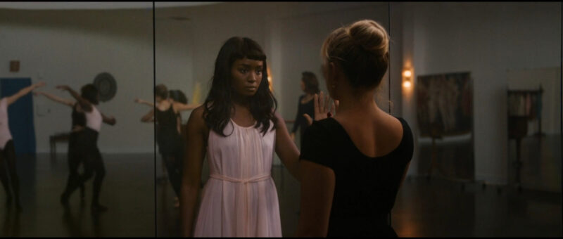 Alice Chambers looks into a mirror to see Margaret