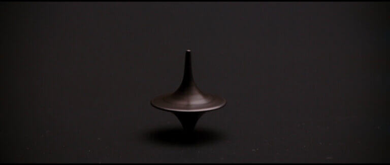 A top spins on a table