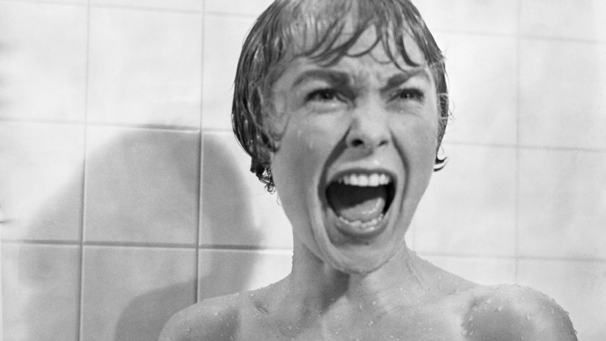 Marion screams in the shower as she's attacked by Norman Bates dressed as his mother