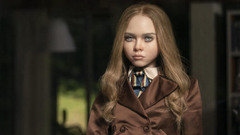 A robot girl in a brown coat stares