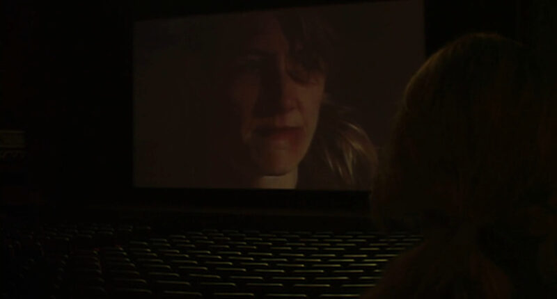 A woman on a movie screen