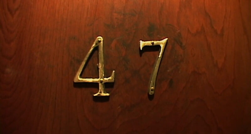 The number 47 appears on an apartment door