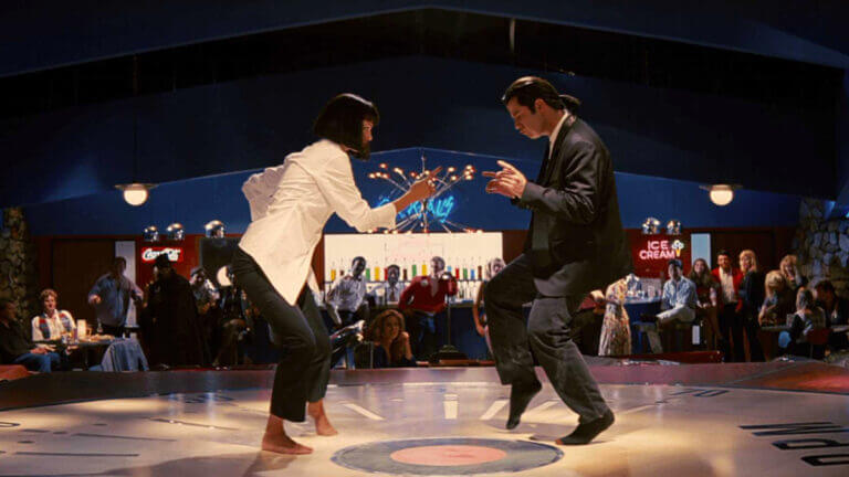 A woman and a man dance in a club