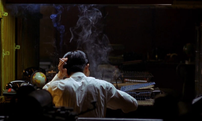 A man smokes in his office