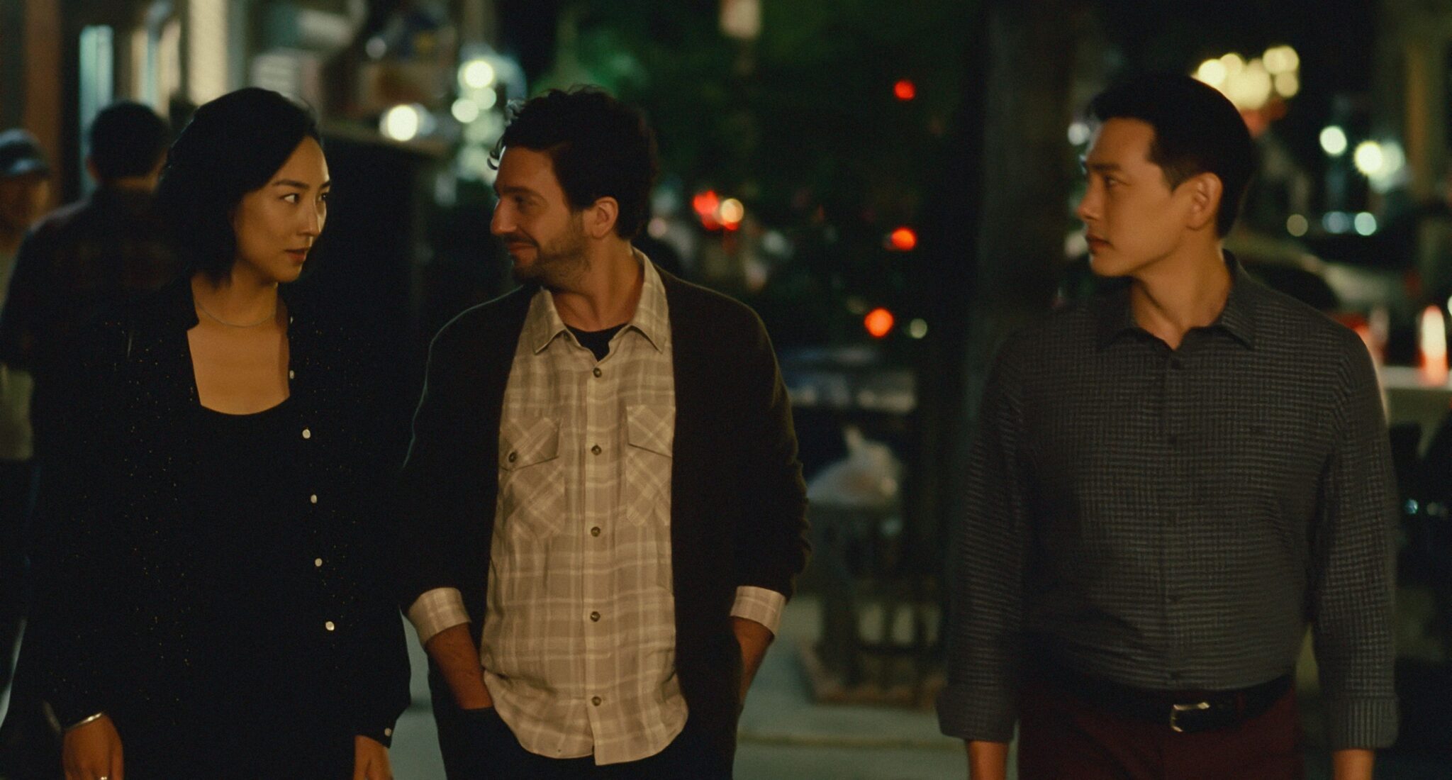 Nora, Arthur, and Hae Sung walk down a street in New York City