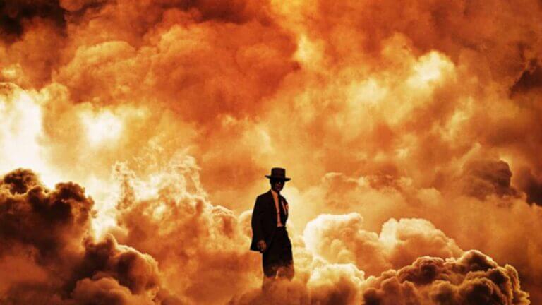 J. Robert Oppenheimer stands in a cloud of fire following a bomb explosion