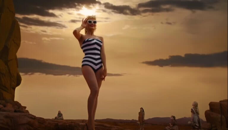 Barbie stands near cliffs and little girls look at her