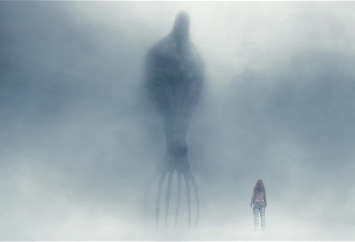 In a foggy room, Louise stands in front of a giant heptapod.