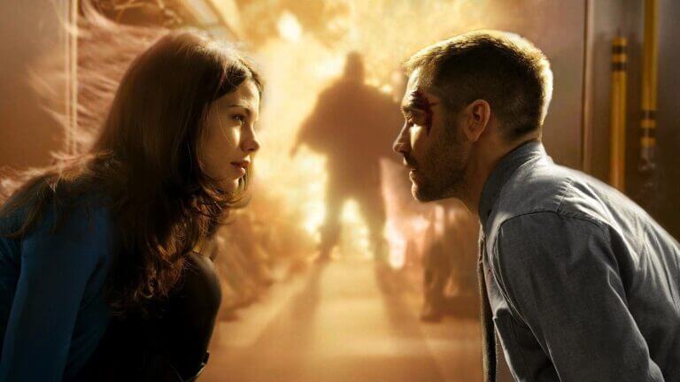 Christina and Colter look into each other's eyes as their train blows up