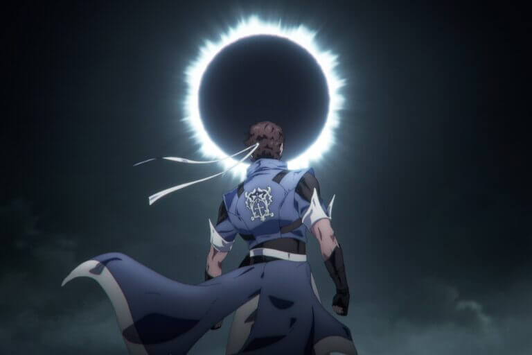 A man looks up at a solar eclipse.