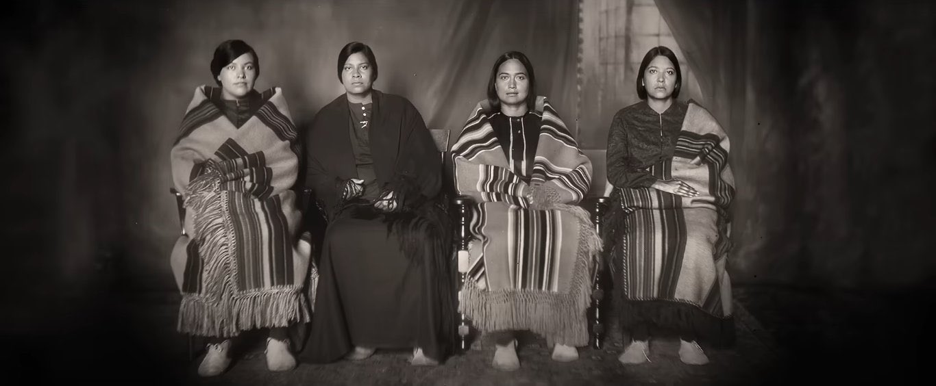 Four Osage women sit for a photo