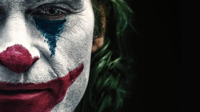 The face of a clown in full makeup