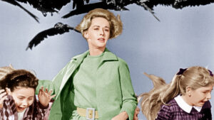 Melanie and two children run away from attacking birds