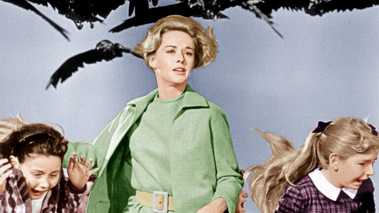 Melanie and two children run away from attacking birds