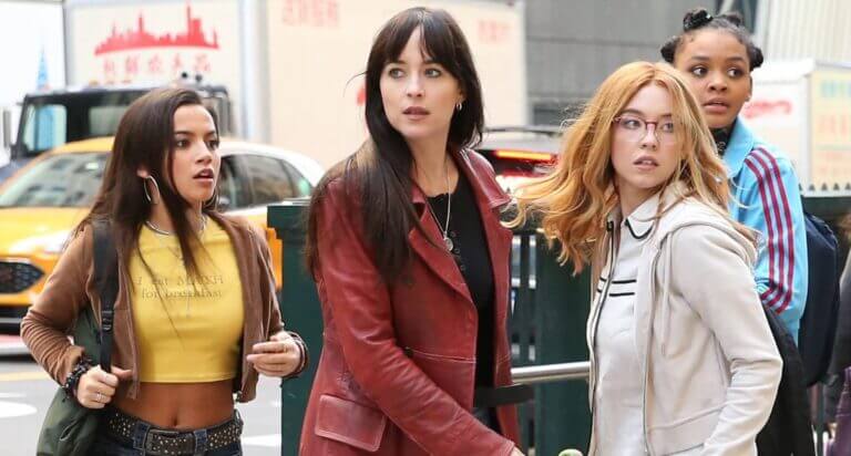 Four women in New York City. They look worried.