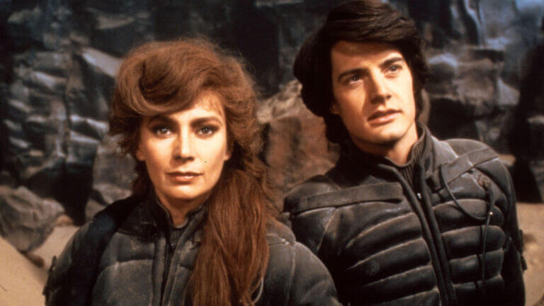 Lady Jessica and Paul Atreides stand on the planet of Arrakis