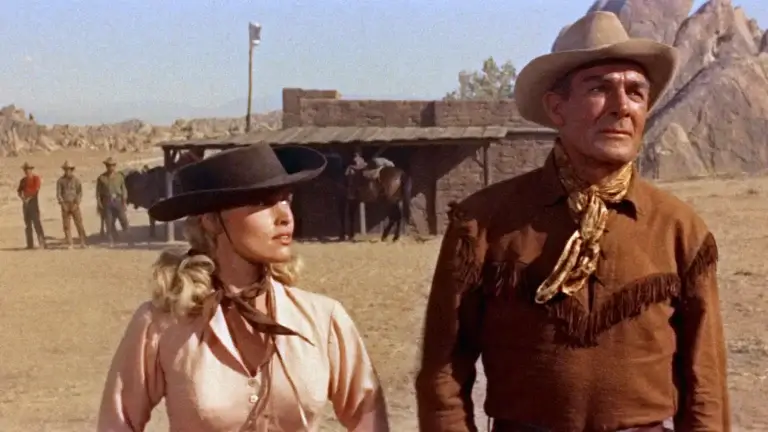 Mrs. Carrie Lane looks at Ben Brigade as they wait in the desert for Frank