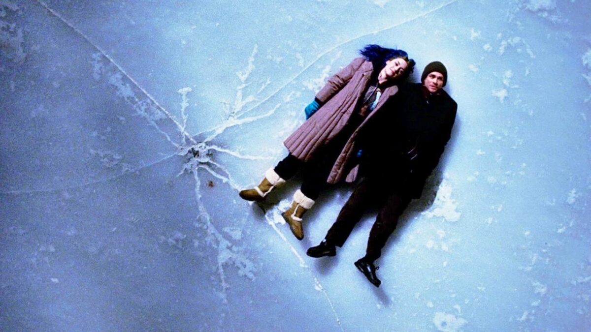 Clementine and Joel lie on the ice together