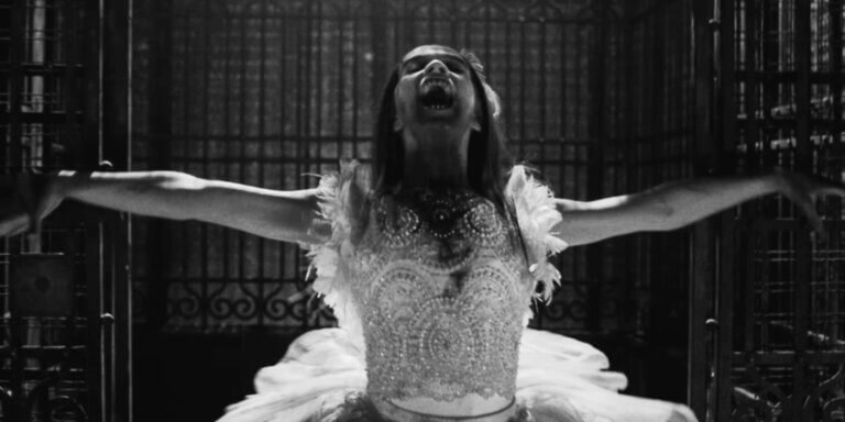 A ballerina vampire postures triumphantly