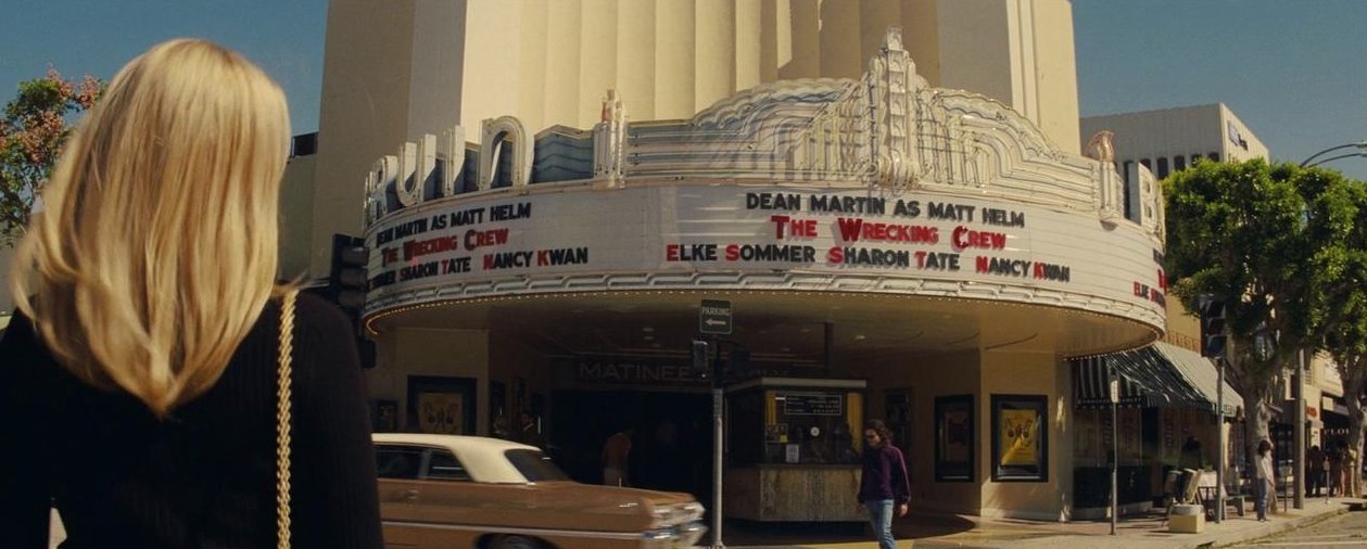 Sharon Tate approaches a movie theater