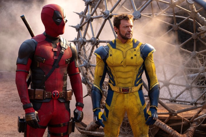 Deadpool and Wolverine look off at something.