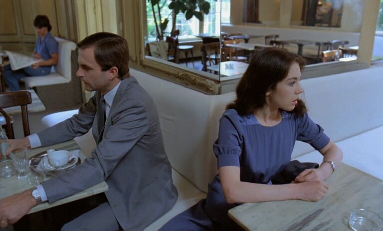 Mark and Anna sit at opposite tables