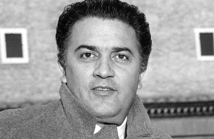 Federico Fellini looks into the camera