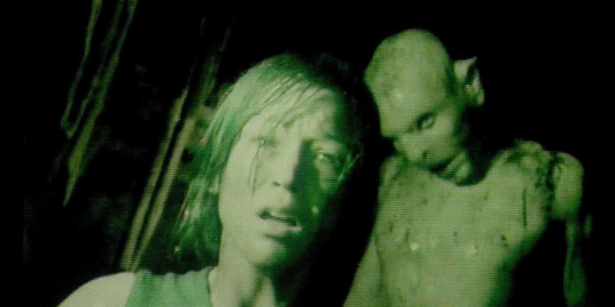 A monster stands behind a woman
